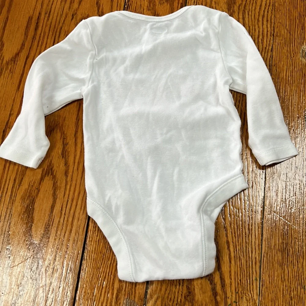 Old Navy white infant girls onsie.Long sleeve w/floral graphic & Love on front